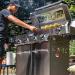 Monument Grills 4 Burner Freestanding Stainless Steel Propane Gas Grill with Clear View Lid Side Burner  and  Infrared Sear Zone