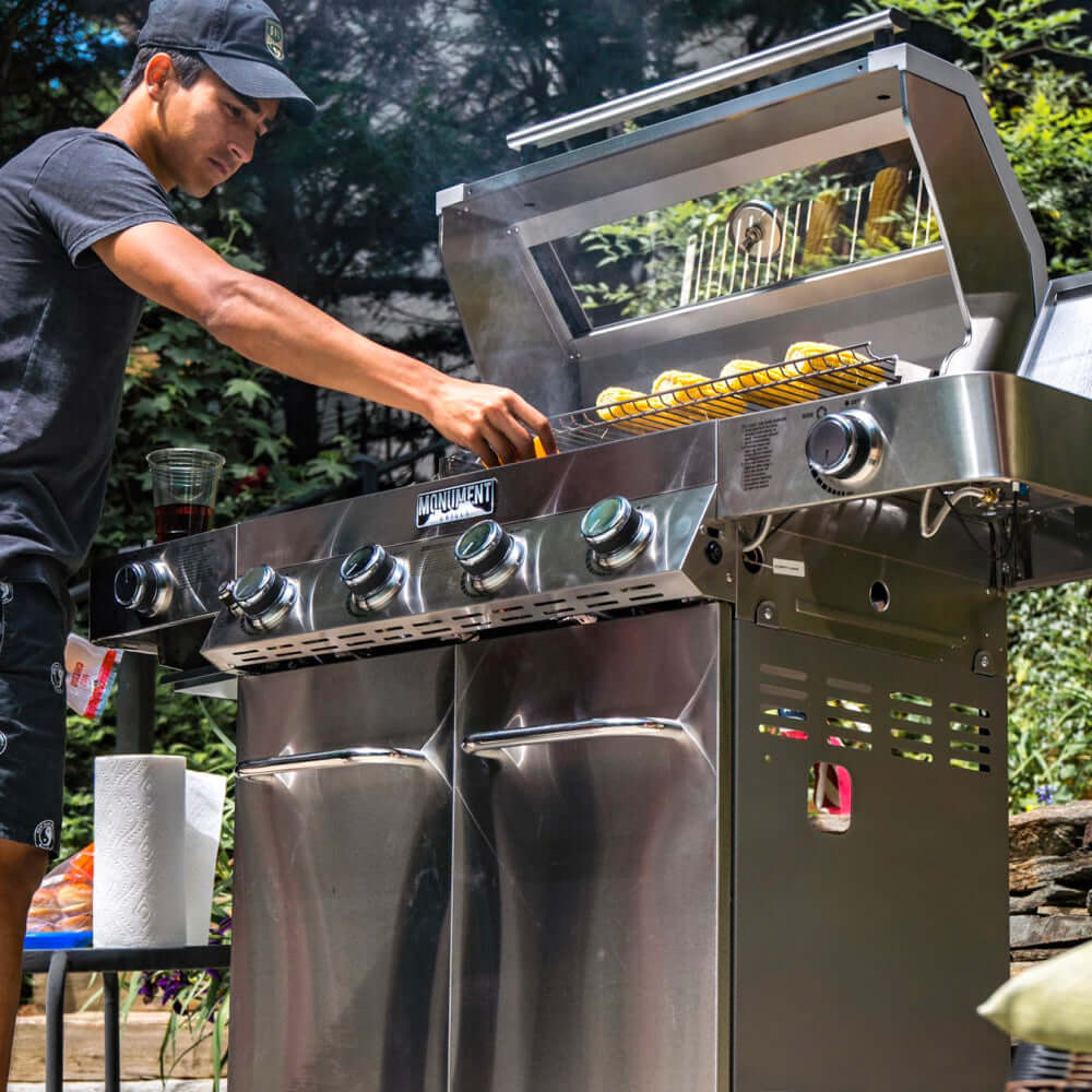 Monument Grills 4 Burner Freestanding Stainless Steel Propane Gas Grill with Clear View Lid Side Burner  and  Infrared Sear Zone