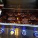 Monument Grills 4 Burner Freestanding Stainless Steel Propane Gas Grill with Clear View Lid Side Burner  and  Infrared Sear Zone