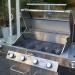 Monument Grills 4 Burner Freestanding Stainless Steel Propane Gas Grill with Clear View Lid Side Burner  and  Infrared Sear Zone