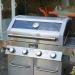 Monument Grills 4 Burner Freestanding Stainless Steel Propane Gas Grill with Clear View Lid Side Burner  and  Infrared Sear Zone