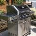 Monument Grills 4 Burner Freestanding Stainless Steel Propane Gas Grill with Clear View Lid Side Burner  and  Infrared Sear Zone